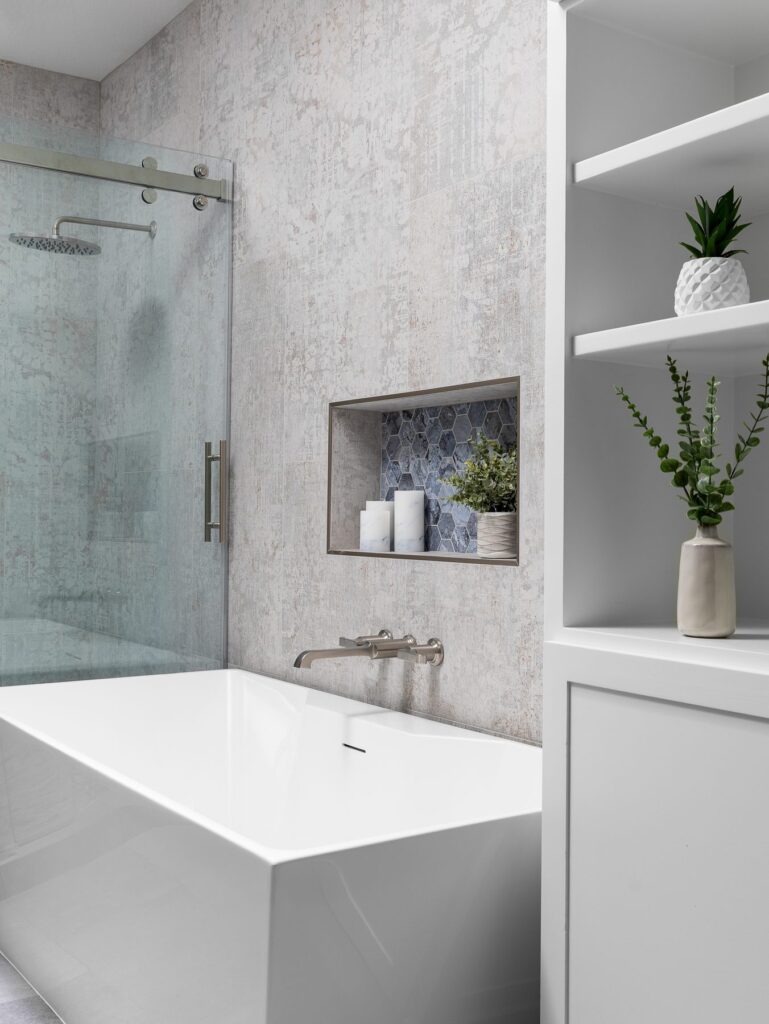 Bath remodel with freestanding tub, glass shower and built-in shelving