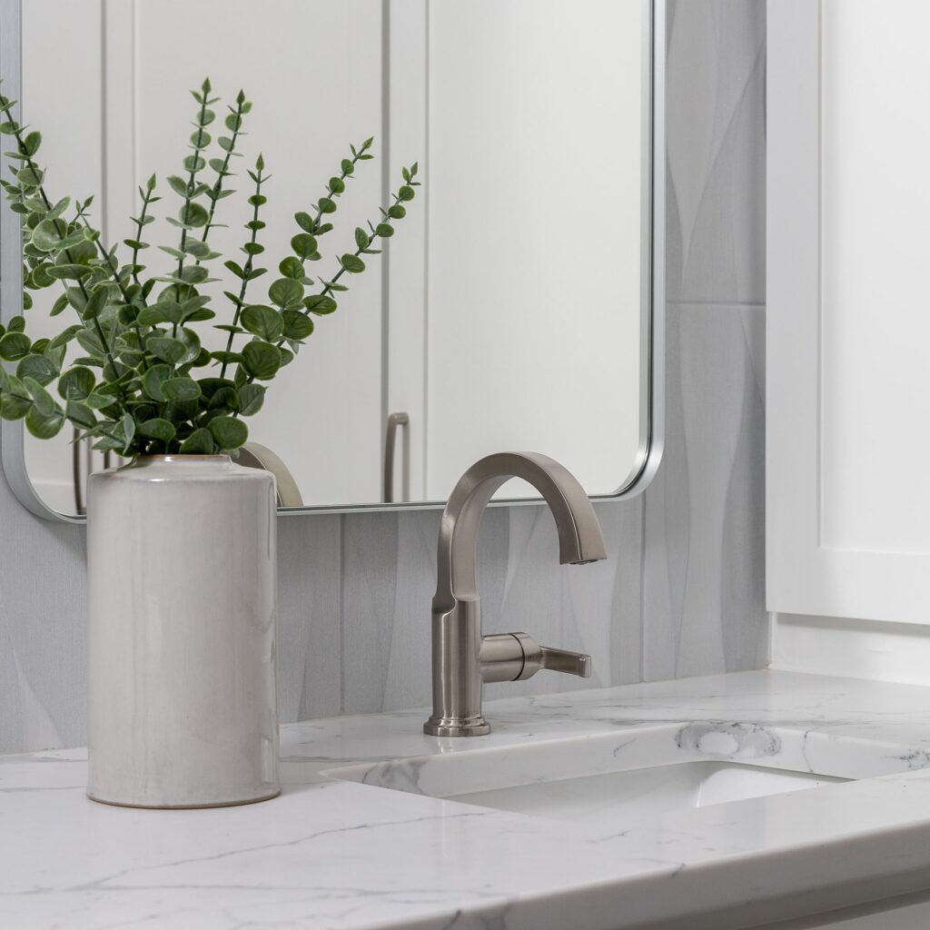 Bath remodel sink with brushed nickel faucet and quartz countertop
