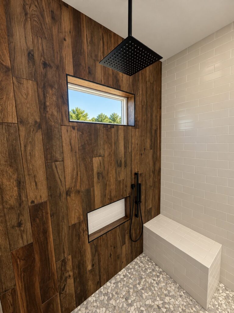 Flower Mound primary shower with rain head, bench and pebble floor
