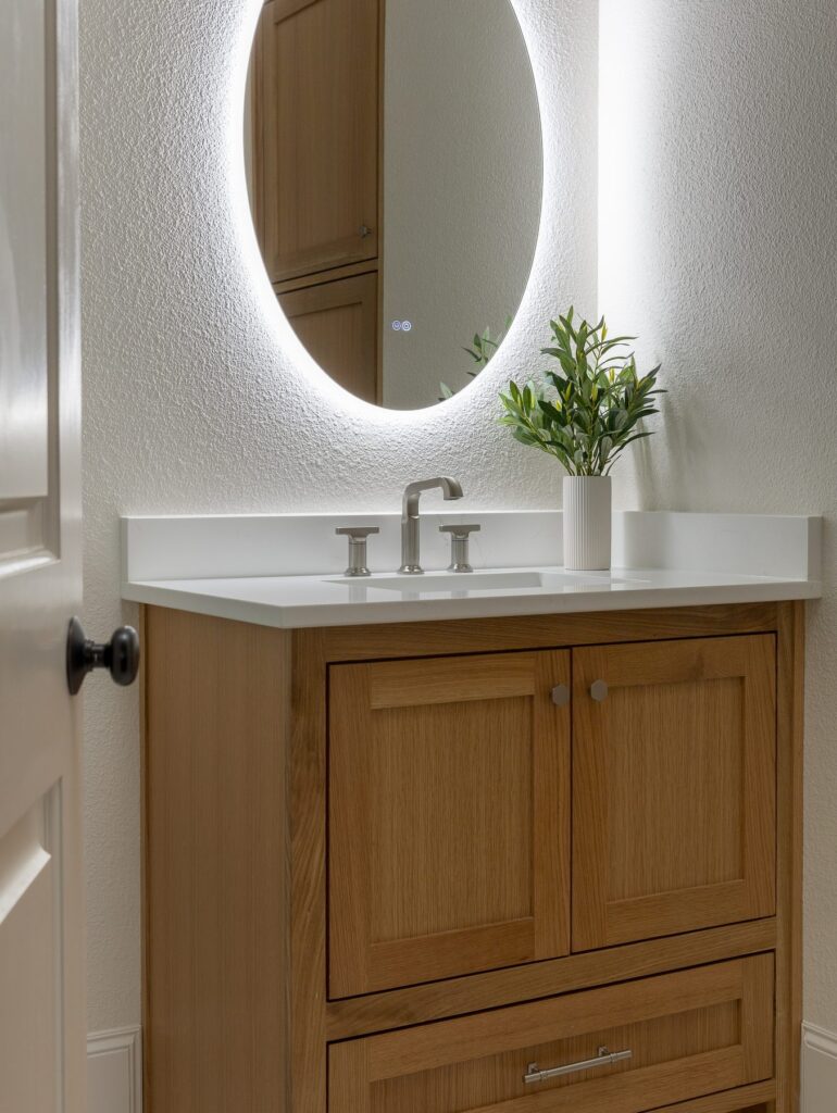 Argyle guest bath vanity with backlit round mirror