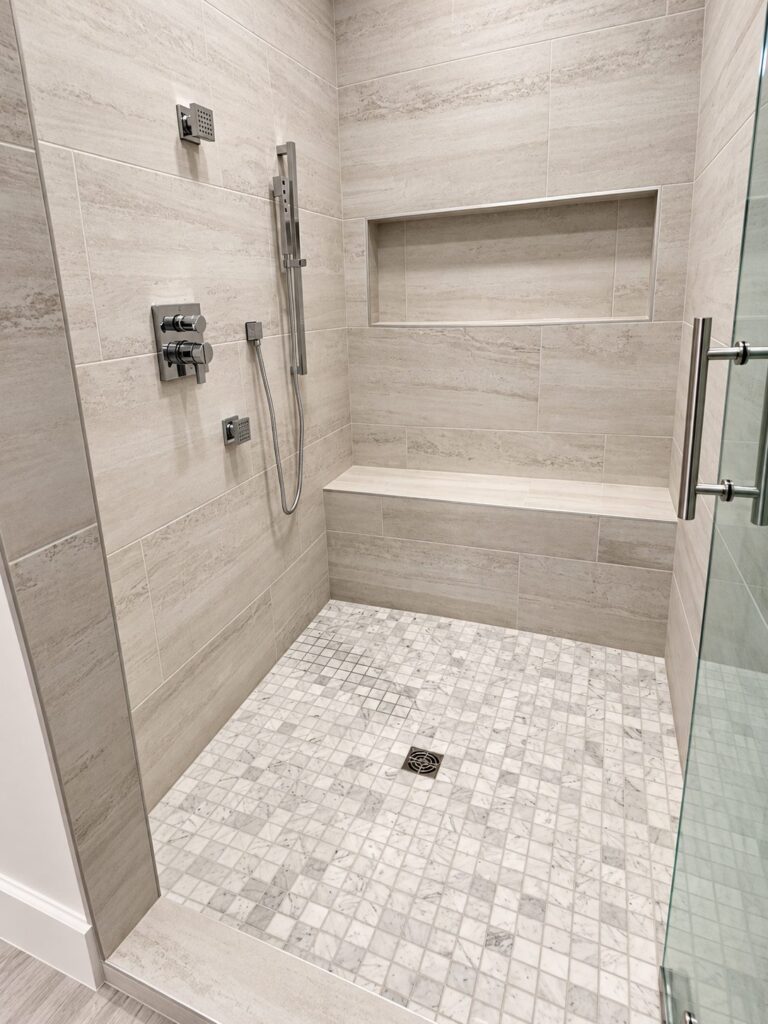 Highland Park primary bath walk-in shower with bench and niche