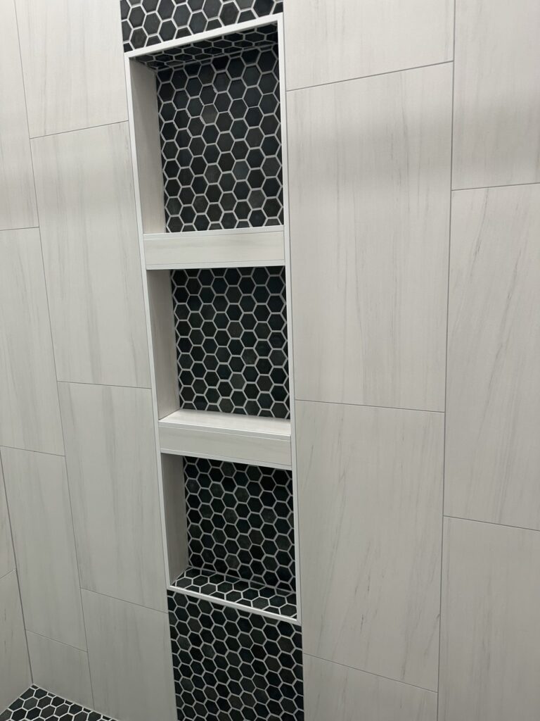 Keller shower niches with black hexagon tile