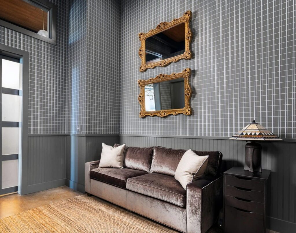 Home office with built-in style bookcases and lounge chair in a whole-home remodel